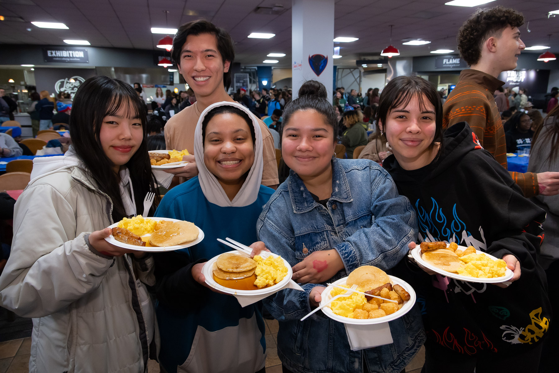 CSH students show off their hearty breakfasts in the Lincoln Park Student Center. (Photo by Jeff Carrion / DePaul University) 